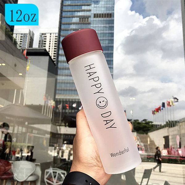 12oz frosted glass water bottle with a cute smiley design, rope-sealed lid, perfect for tea, juice, or coffee, portable and ideal as a student gift