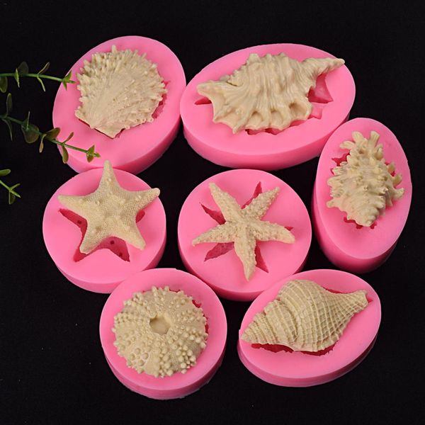 3D baking molds for food-grade fondant in marine designs, perfect for DIY cake decorating with ocean-themed shapes like conch, starfish, and seashells