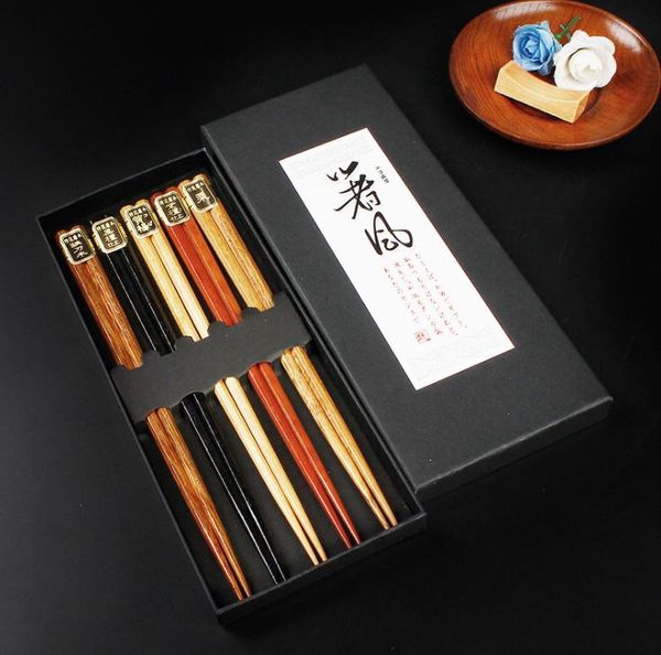 50 Chinese wooden chopsticks set with anti-slip design, includes a holder and comes in a gift box SN539