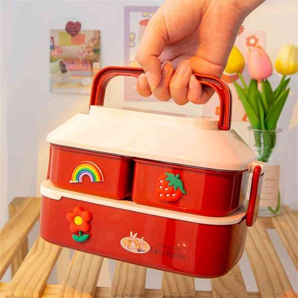 Adorable kids' lunch box with separate compartments and utensils, ideal for school or outdoor meals