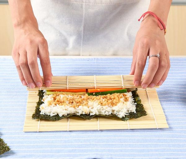 Bamboo sushi rolling mats and rice paddles for DIY kitchen use
