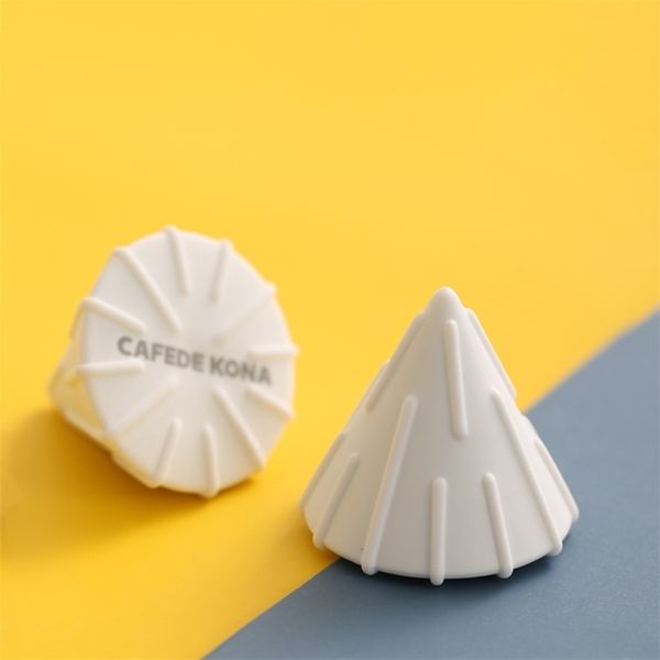 CAFEDEKONA's coffee dripper transforms into a brewer assistant tool, creating waves with paper filters that fit V60 and enhance sweetness