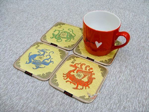 Decorative Christmas unicorn coaster set with Chinese silk brocade design, 4 square pads for tea or coffee, ideal party favors or table mats