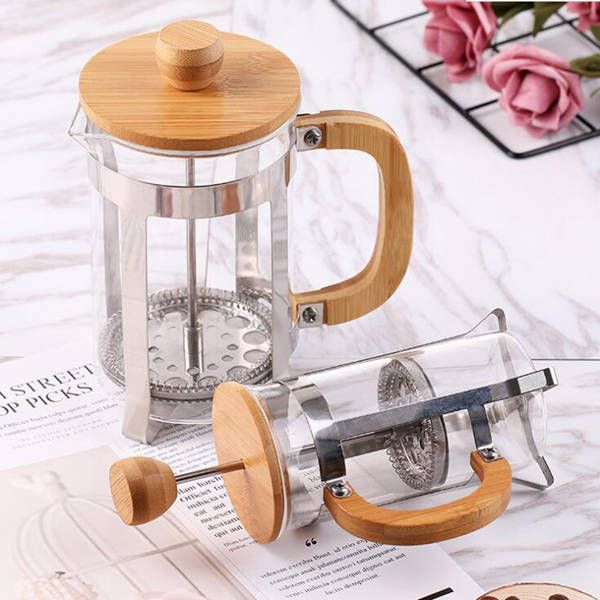 French press coffee maker with bamboo lid  
Hand-operated home strainer for tea and coffee