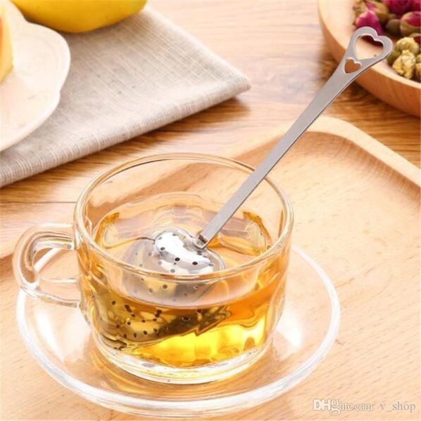 Heart-shaped stainless steel tea infuser with mesh filter and locking spoon design