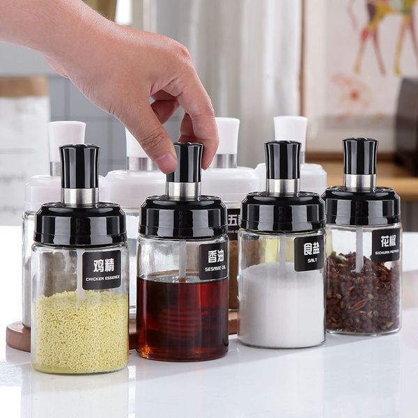 Integrated seasoning container set with glass jars, oil spoon, and salt dispenser