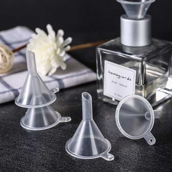 Mini transparent plastic small funnels for perfume, essential oils, and liquid filling in kitchen and bar settings