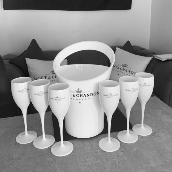 Moet's unbreakable 175ml acrylic champagne glasses in orange and white hues