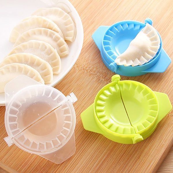 Multifunctional plastic dumpling mold for kitchen use, a versatile tool to shape and cut dumplings and pastry wrappers