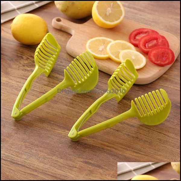 Multi-purpose handheld clamp for slicing lemons, onions, tomatoes and other fruits