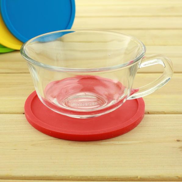 Non-slip rubber coasters with raised edges to catch spills, perfect for home or party use