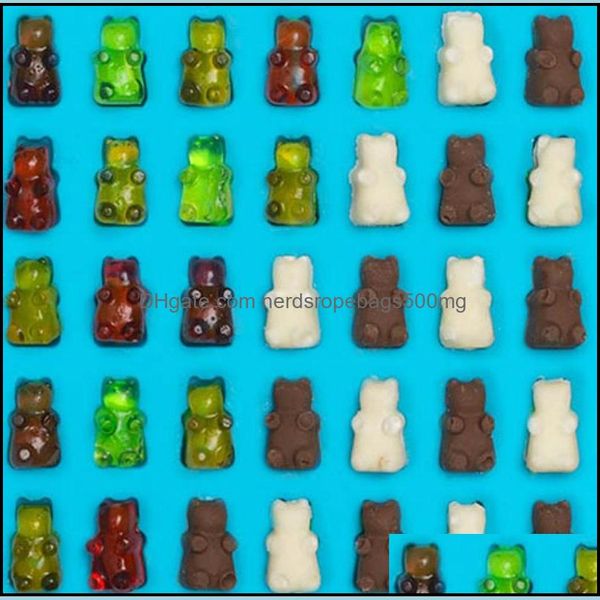 Nonstick food-grade silicone molds for gummy bears and chocolate, includes a dropper