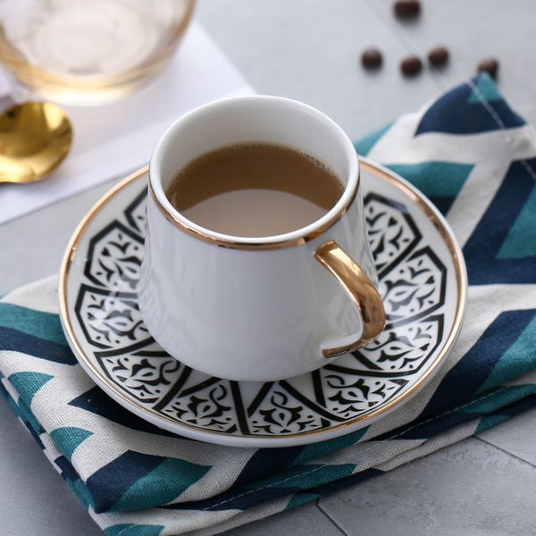 Nordic-inspired white ceramic travel coffee cup and saucer set with modern design for afternoon tea