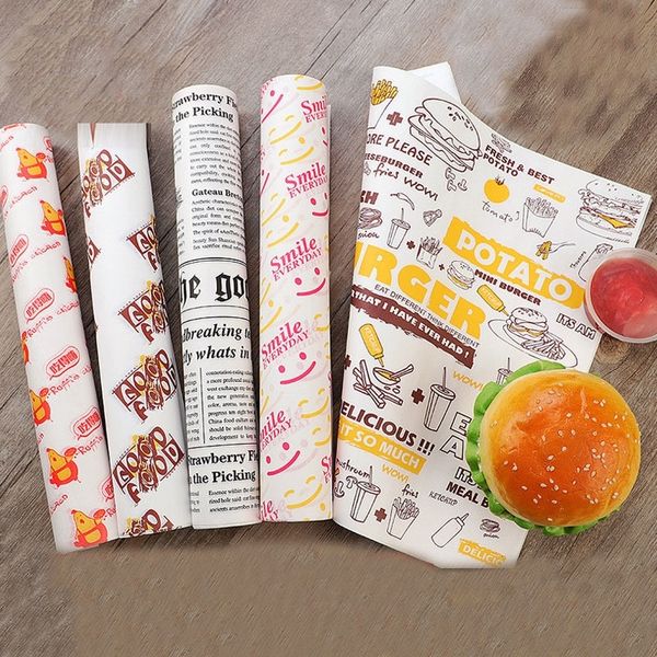 Oil-resistant wax paper sheets for wrapping food items like sandwiches, burgers, and fries during baking or fast food service