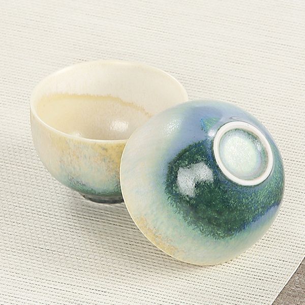 Retro stoneware tea master cup with kiln-altered glaze, ideal for a single serving