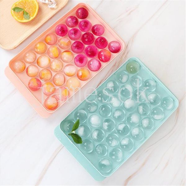 Round ice cube tray with lid for making ice balls in freezer, perfect for chilling cocktails, whiskey, and coffee