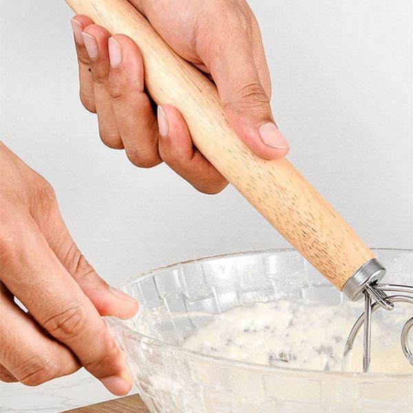 Stainless steel 13-inch egg beater for baking, featuring an oak wood handle and ideal for dough mixing