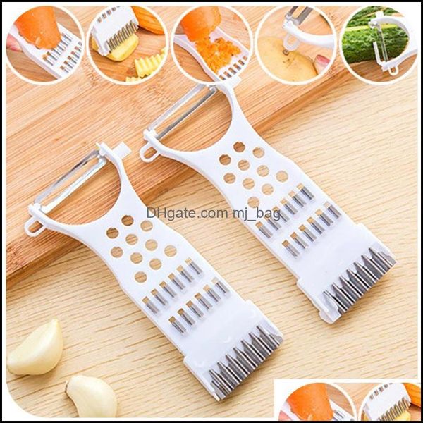 Stainless steel peeler and grater for slicing cucumbers and fruits in the kitchen