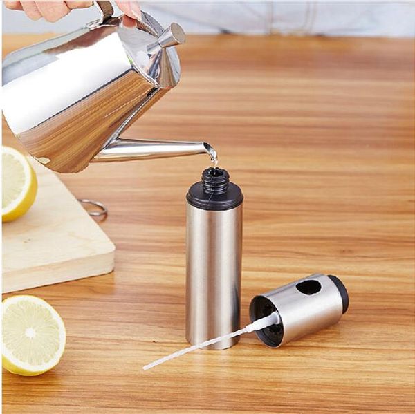 Stainless steel thumb-operated oil spray bottle for kitchen use
