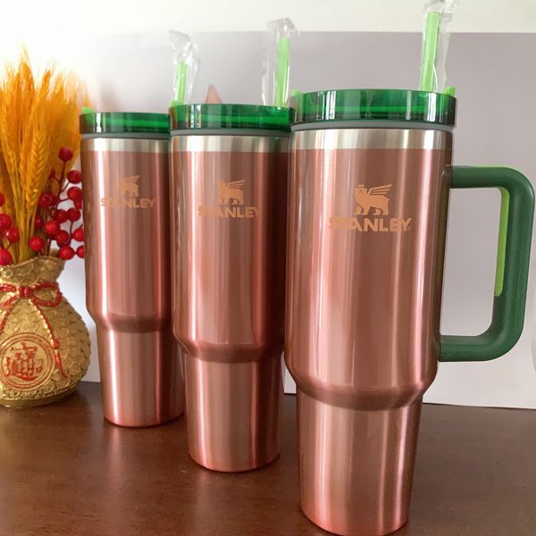 Stanley insulated 40oz tumbler with pink tie-dye H2.0 logo, handle, straw, and stainless steel construction