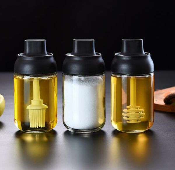 The innovative moisture-proof glass-sealed spoon cover combined seasoning bottle with brush for oil or honey storage