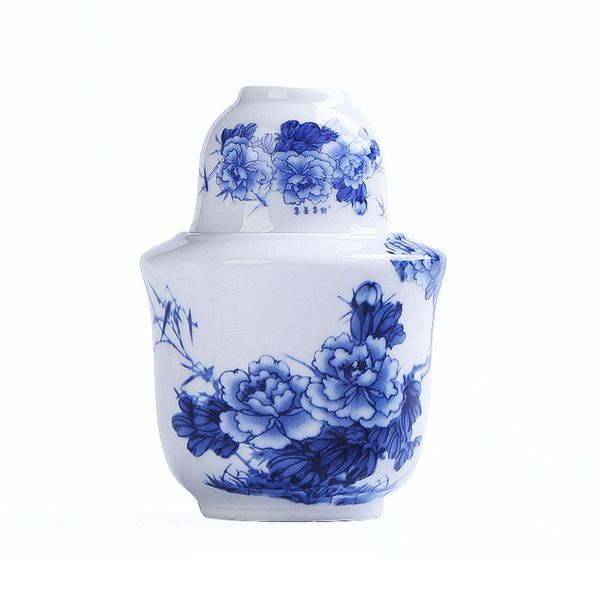 Vintage blue and white porcelain sake set with warmer, cup, and floral design for one person