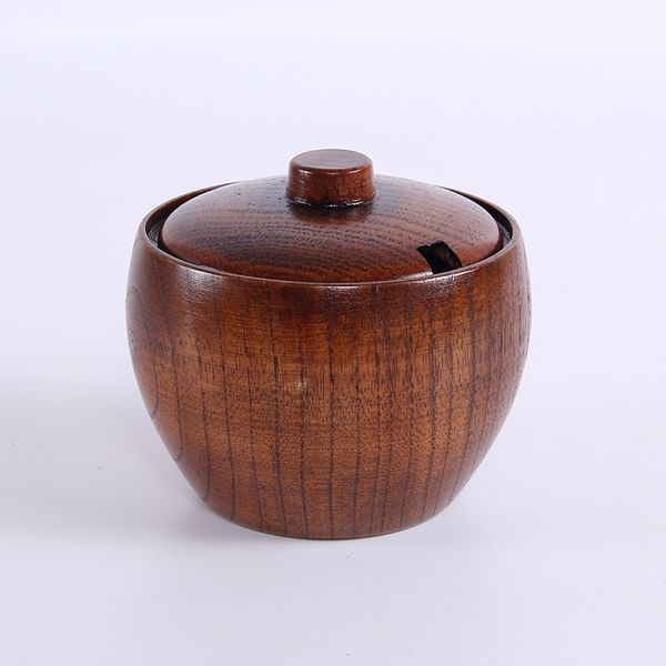 Wooden seasoning containers for kitchen use including salt and pepper shakers, sauce pots, and dish sets